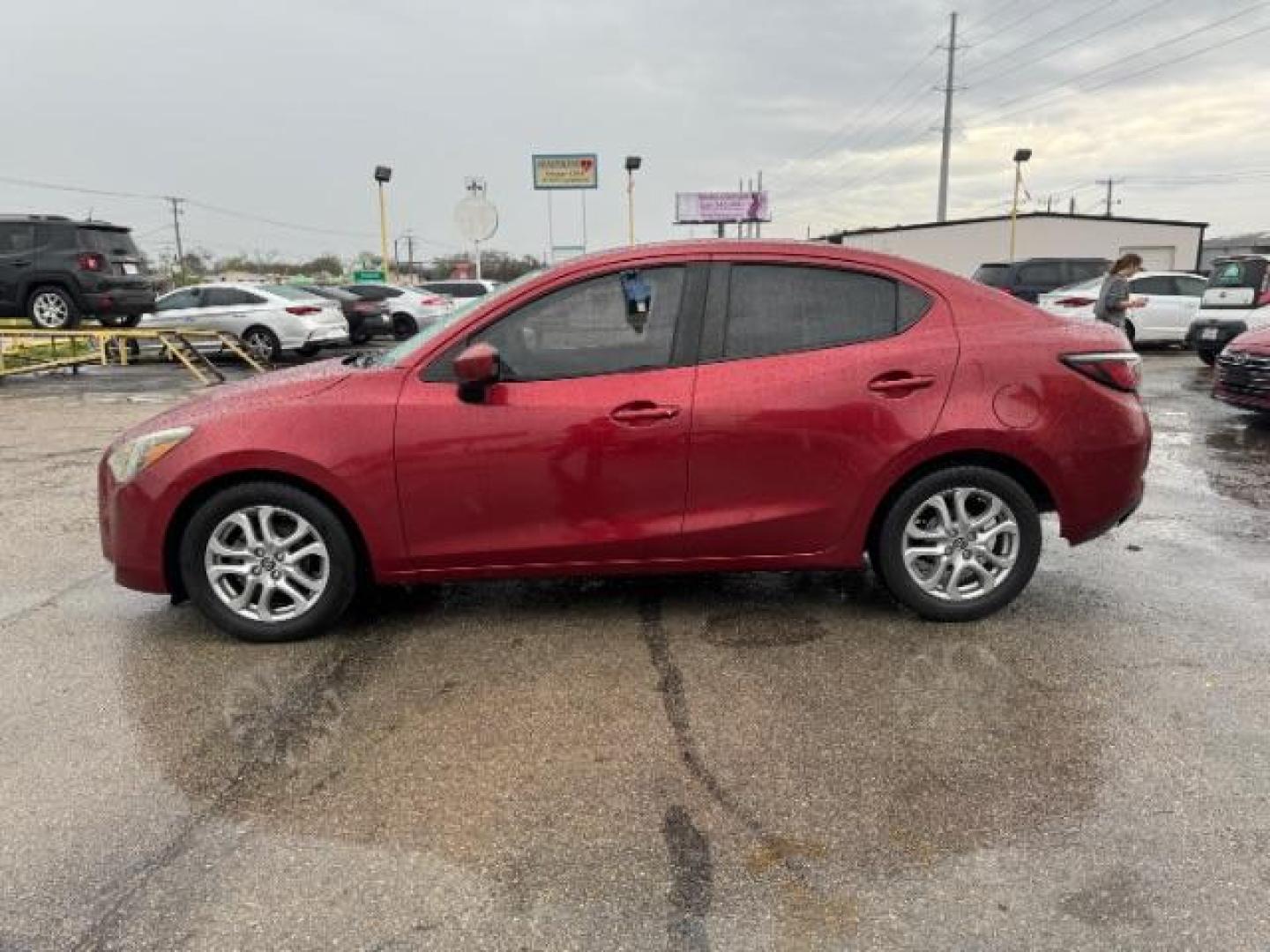 2016 RED Scion iA 6A (3MYDLBZV5GY) with an 1.5L L4 DOHC 16V engine, 6-Speed Automatic transmission, located at 2715 W Pioneer Pkwy, Arlington, TX, 76013, (817) 265-9009, 32.710262, -97.153236 - Photo#1