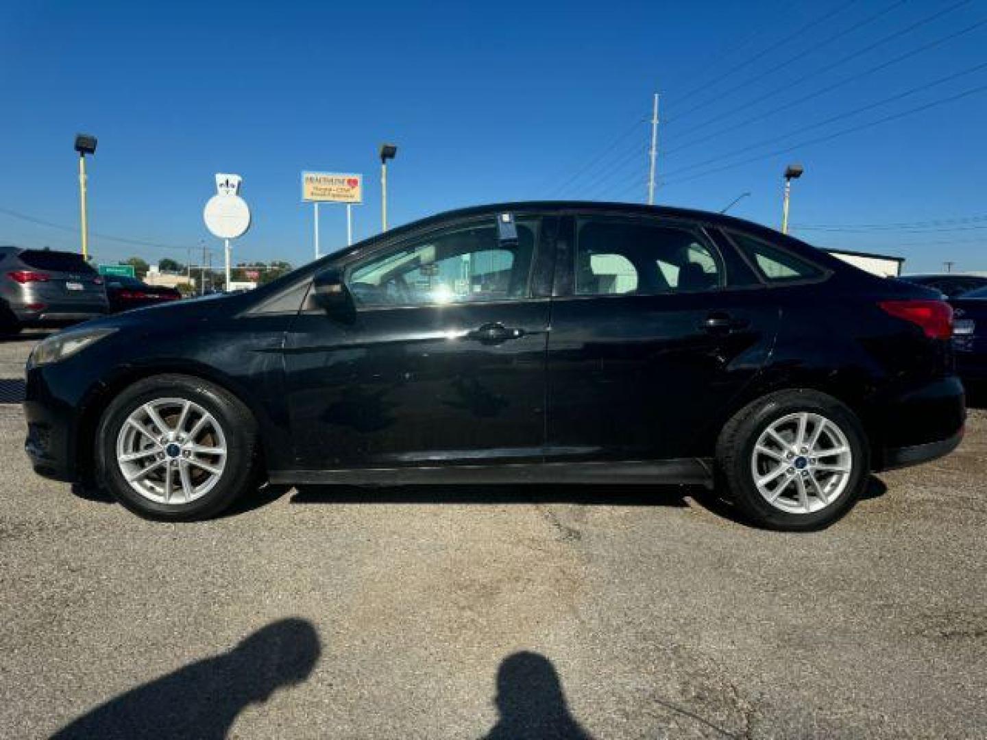 2017 BLACK Ford Focus SE Sedan (1FADP3F24HL) with an 2.0L L4 DOHC 16V engine, located at 2715 W Pioneer Pkwy, Arlington, TX, 76013, (817) 265-9009, 32.710262, -97.153236 - Photo#2
