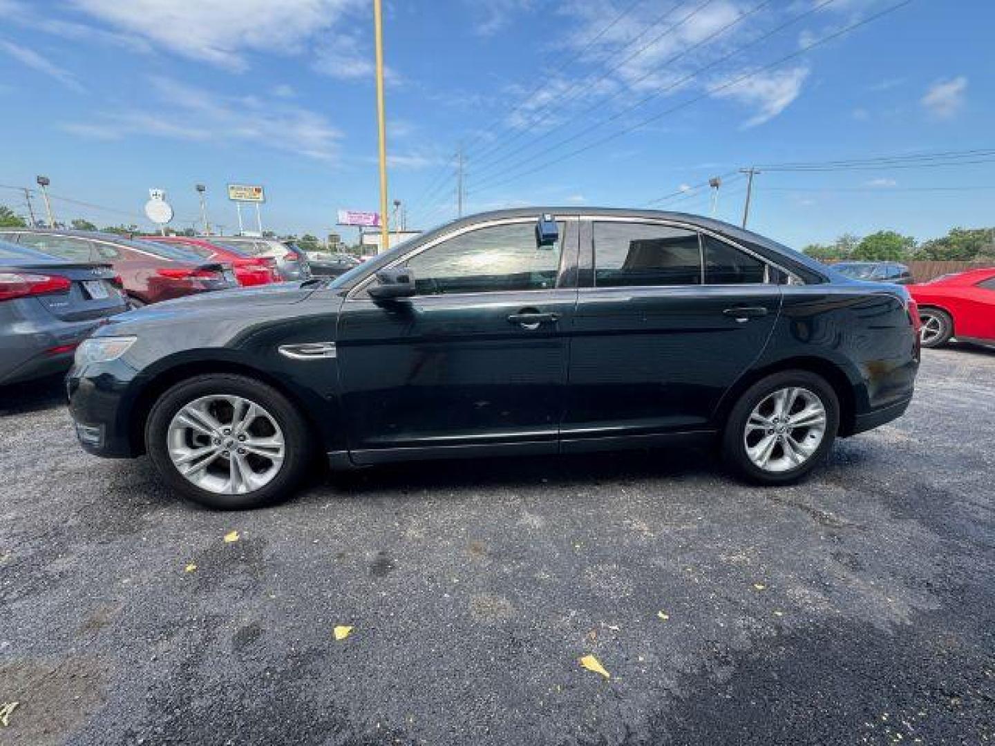 2014 BLACK Ford Taurus SEL FWD (1FAHP2E8XEG) with an 3.5L V6 DOHC 24V engine, 6-Speed Automatic transmission, located at 2715 W Pioneer Pkwy, Arlington, TX, 76013, (817) 265-9009, 32.710262, -97.153236 - Photo#1