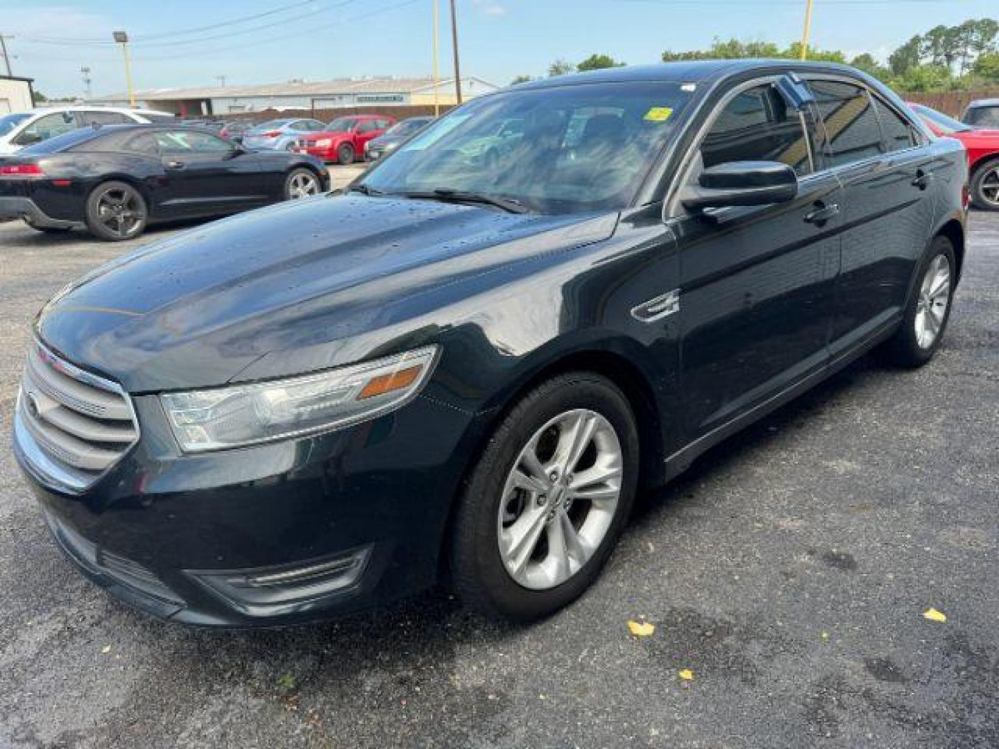 2014 BLACK Ford Taurus SEL FWD (1FAHP2E8XEG) with an 3.5L V6 DOHC 24V engine, 6-Speed Automatic transmission, located at 2715 W Pioneer Pkwy, Arlington, TX, 76013, (817) 265-9009, 32.710262, -97.153236 - Photo#2