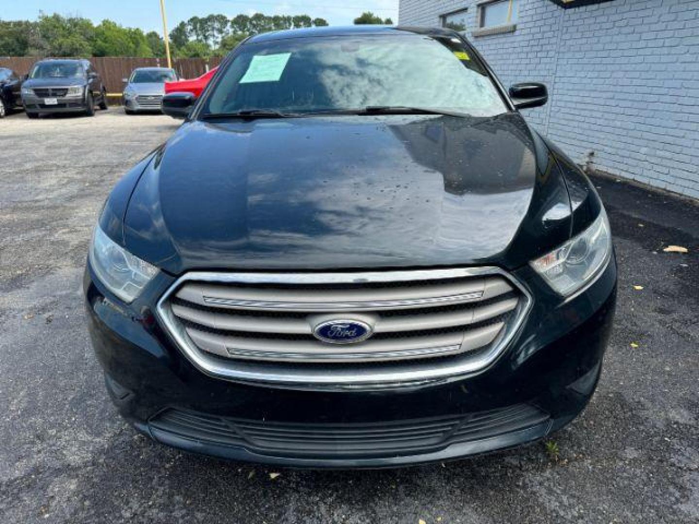2014 BLACK Ford Taurus SEL FWD (1FAHP2E8XEG) with an 3.5L V6 DOHC 24V engine, 6-Speed Automatic transmission, located at 2715 W Pioneer Pkwy, Arlington, TX, 76013, (817) 265-9009, 32.710262, -97.153236 - Photo#3