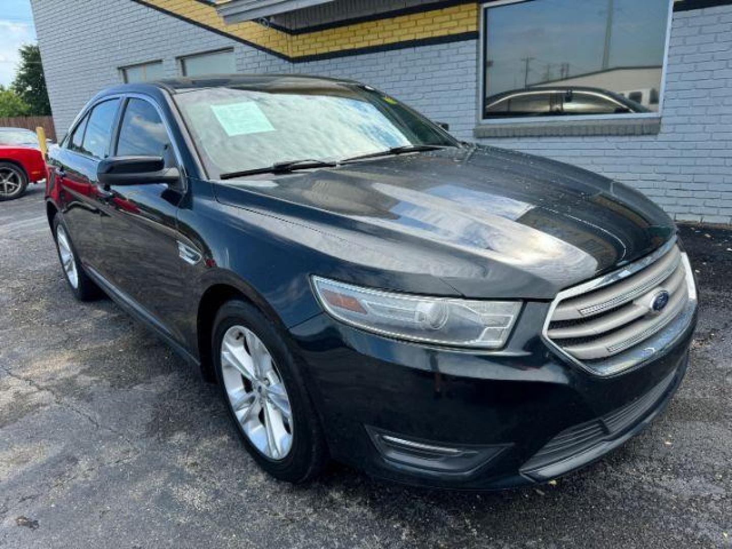 2014 BLACK Ford Taurus SEL FWD (1FAHP2E8XEG) with an 3.5L V6 DOHC 24V engine, 6-Speed Automatic transmission, located at 2715 W Pioneer Pkwy, Arlington, TX, 76013, (817) 265-9009, 32.710262, -97.153236 - Photo#4