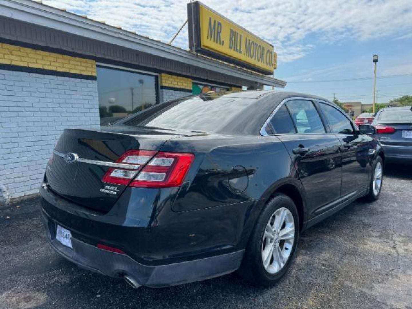 2014 BLACK Ford Taurus SEL FWD (1FAHP2E8XEG) with an 3.5L V6 DOHC 24V engine, 6-Speed Automatic transmission, located at 2715 W Pioneer Pkwy, Arlington, TX, 76013, (817) 265-9009, 32.710262, -97.153236 - Photo#5