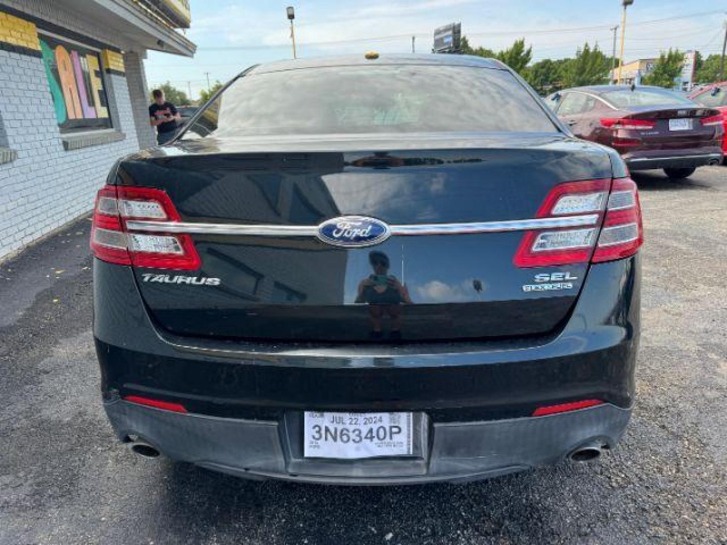 2014 BLACK Ford Taurus SEL FWD (1FAHP2E8XEG) with an 3.5L V6 DOHC 24V engine, 6-Speed Automatic transmission, located at 2715 W Pioneer Pkwy, Arlington, TX, 76013, (817) 265-9009, 32.710262, -97.153236 - Photo#6