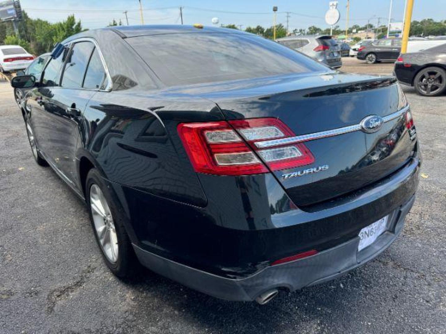 2014 BLACK Ford Taurus SEL FWD (1FAHP2E8XEG) with an 3.5L V6 DOHC 24V engine, 6-Speed Automatic transmission, located at 2715 W Pioneer Pkwy, Arlington, TX, 76013, (817) 265-9009, 32.710262, -97.153236 - Photo#7