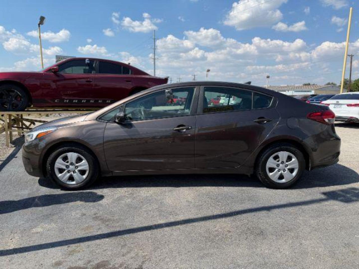 2017 BROWN Kia Forte LX 6A (3KPFL4A78HE) with an 2.0L L4 DOHC 16V engine, 6-Speed Automatic transmission, located at 2715 W Pioneer Pkwy, Arlington, TX, 76013, (817) 265-9009, 32.710262, -97.153236 - Photo#1