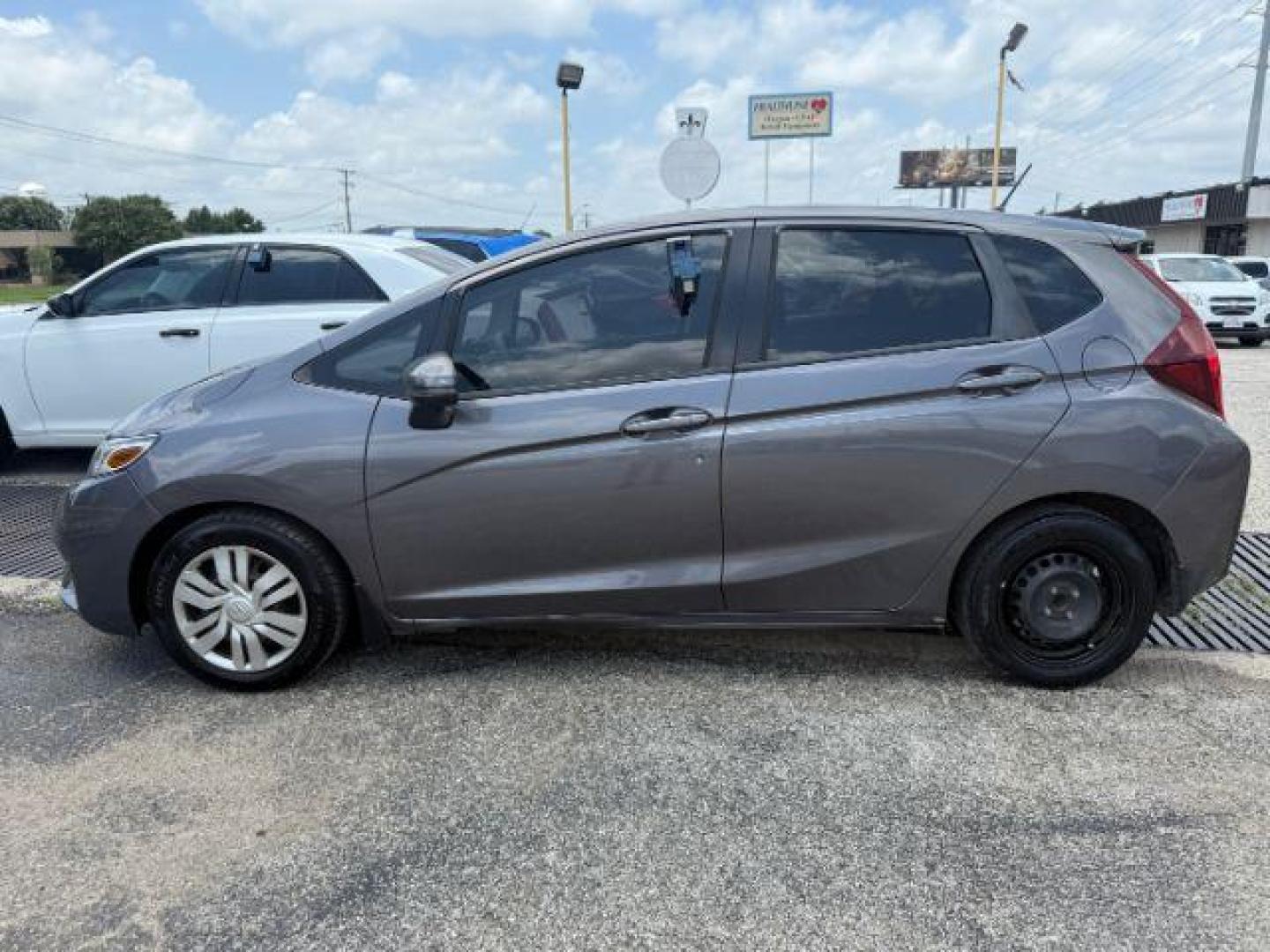 2016 GRAY Honda Fit LX CVT (JHMGK5H5XGX) with an 1.5L L4 SOHC 16V engine, Continuously Variable Transmission transmission, located at 2715 W Pioneer Pkwy, Arlington, TX, 76013, (817) 265-9009, 32.710262, -97.153236 - Photo#2
