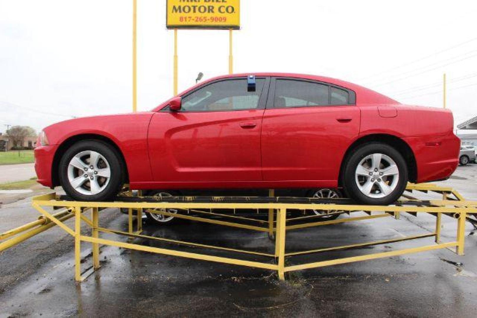 2012 RED Dodge Charger SXT (2C3CDXHG3CH) with an 3.6L V6 DOHC 24V engine, 5-Speed Automatic transmission, located at 2715 W Pioneer Pkwy, Arlington, TX, 76013, (817) 265-9009, 32.710262, -97.153236 - Photo#1