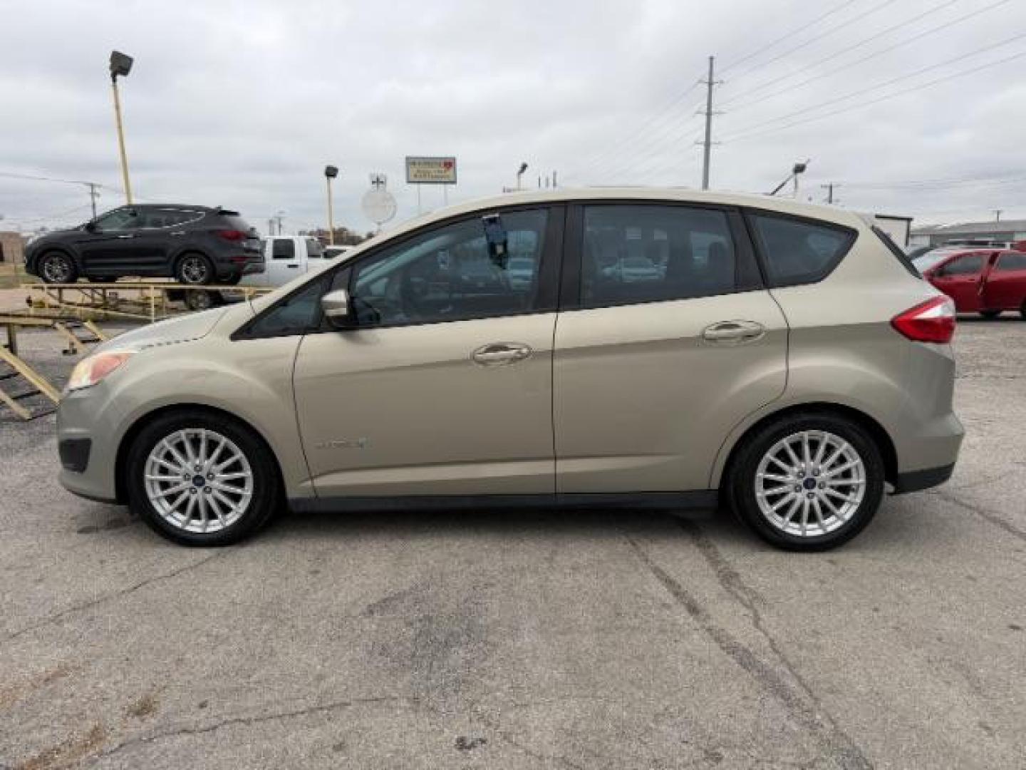 2016 TAN Ford C-Max Hybrid SE (1FADP5AU5GL) with an 2L I-4 DOHC engine, located at 2715 W Pioneer Pkwy, Arlington, TX, 76013, (817) 265-9009, 32.710262, -97.153236 - Photo#2